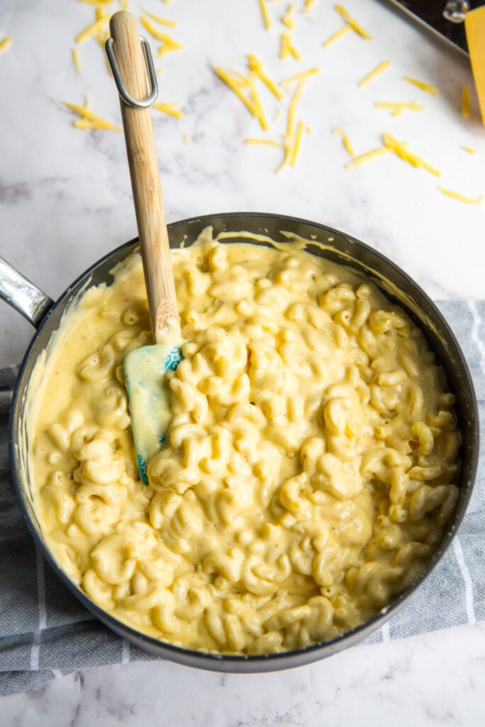 Skillet of creamy mac and cheese before baking