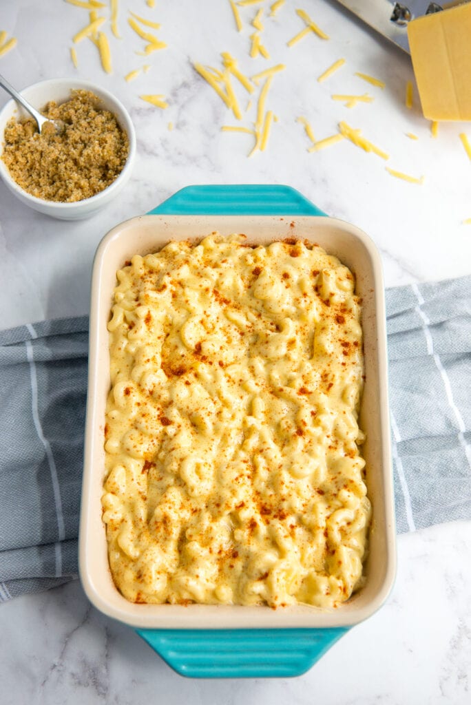 Teal Blue baking dish of Creamy Mac & Cheese sprinkled with Paprika