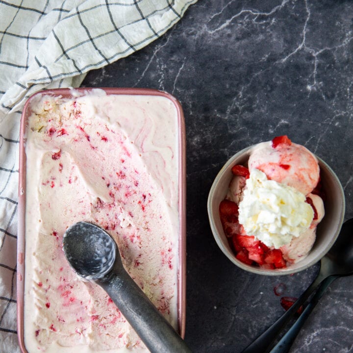 Strawberry Ice Cream in a container and served in a bowl